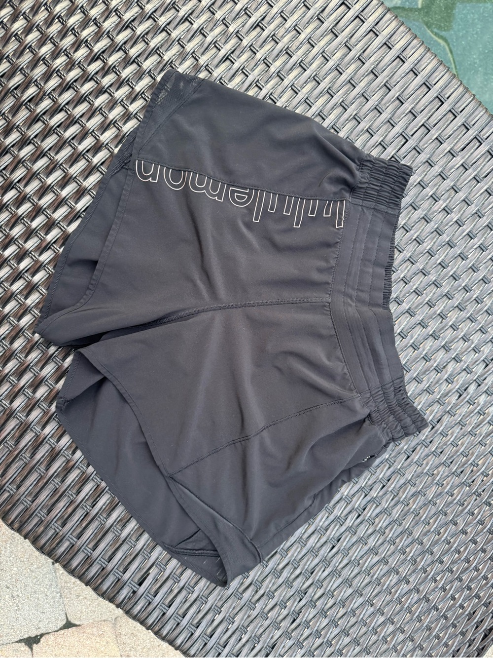 Lululemon Women's Black Athletic Shorts with reflective branding on front